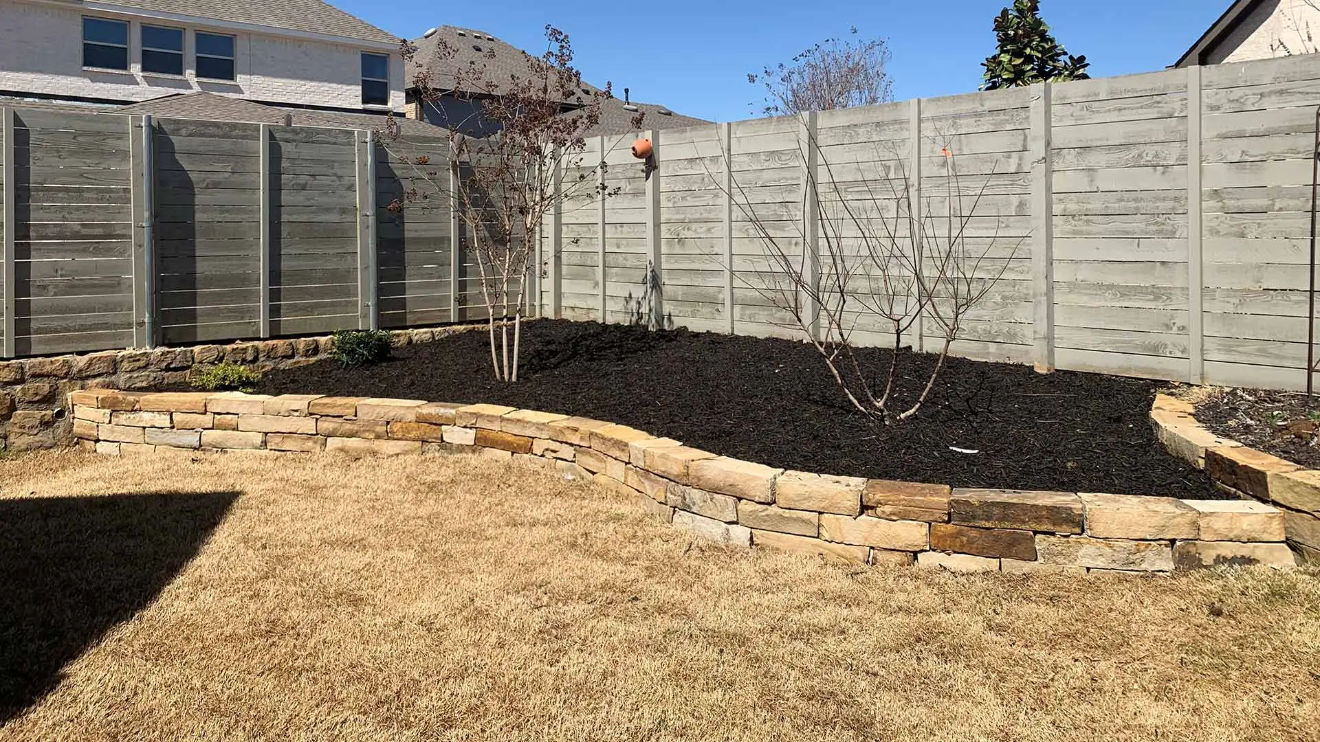 A large landscape bed with added mulch in Argyle, TX.