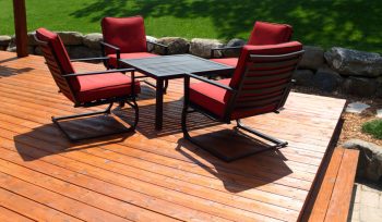 Deck with red chairs.